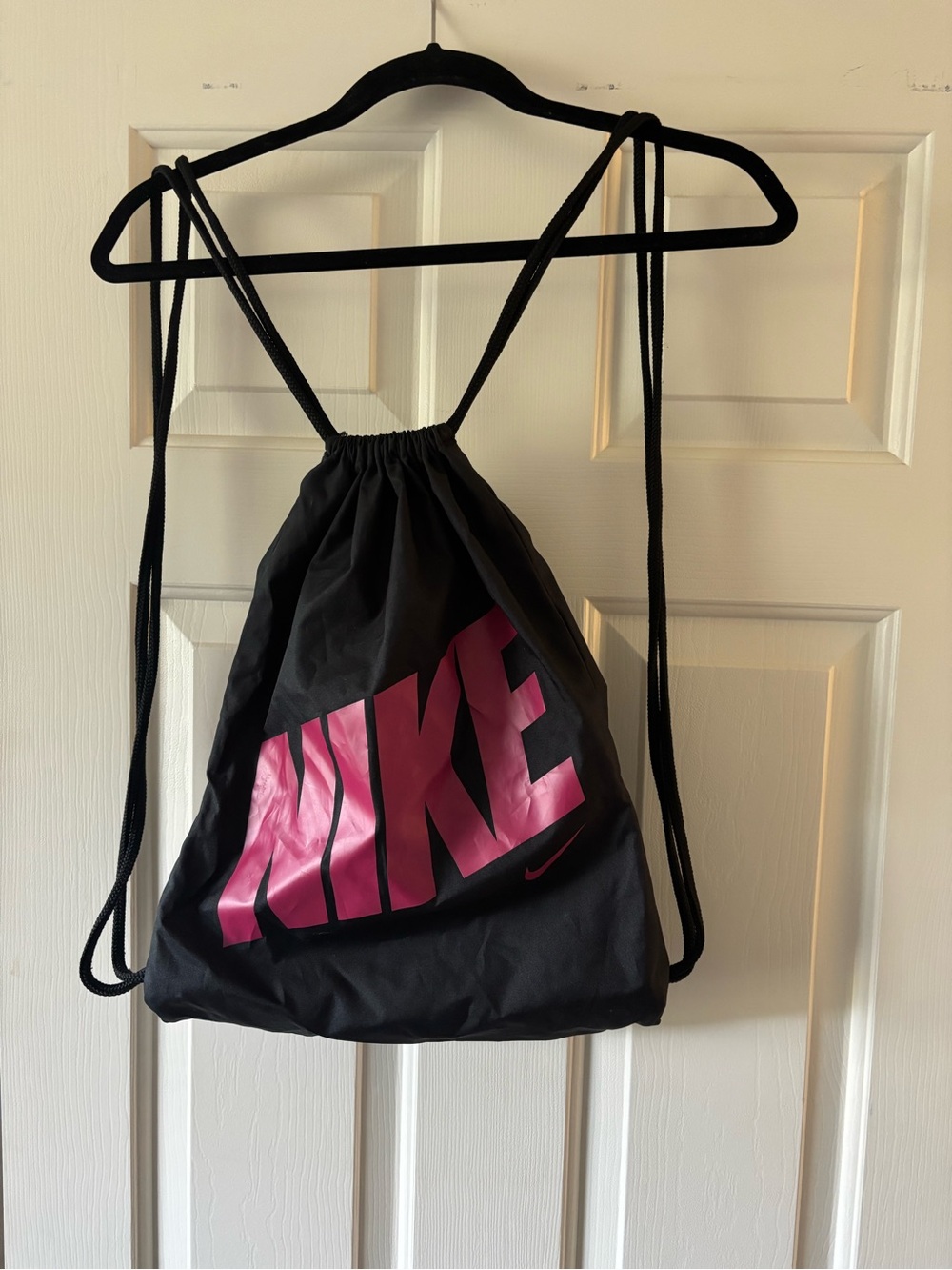 Nike Black Drawstring Backpack with Pink Logo
